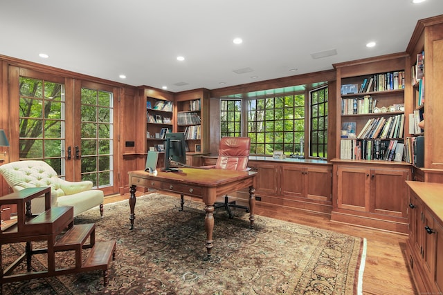 office area featuring light wood finished floors, recessed lighting, and french doors