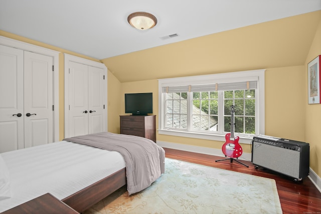 114 Ferris Hill Rd, New Canaan, CT 06840 - bedroom featuring lofted ceiling, wood finished floors, baseboards, and two closets