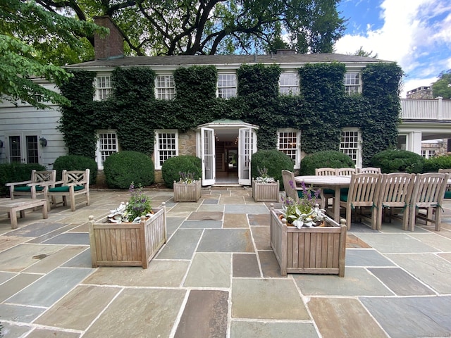 view of patio featuring outdoor dining area