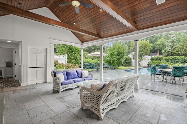 view of patio / terrace featuring a fenced in pool, outdoor lounge area, outdoor dining space, ceiling fan, and fence