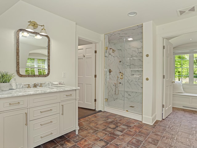 bathroom featuring vanity and walk in shower