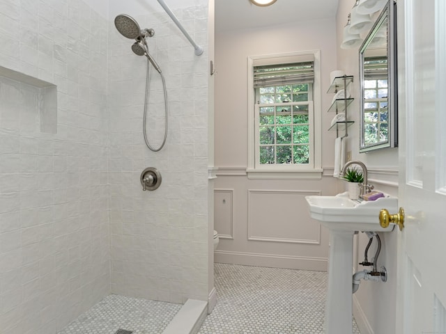 bathroom with tile patterned floors and a tile shower