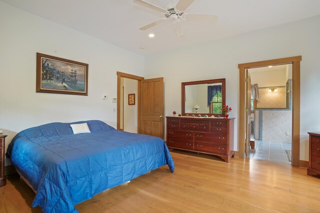 bedroom with ceiling fan and light hardwood / wood-style floors