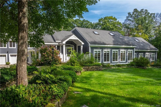 12 W Mountain Rd, Sharon, CT 06069 - back of house with a garage, roof with shingles, and a yard