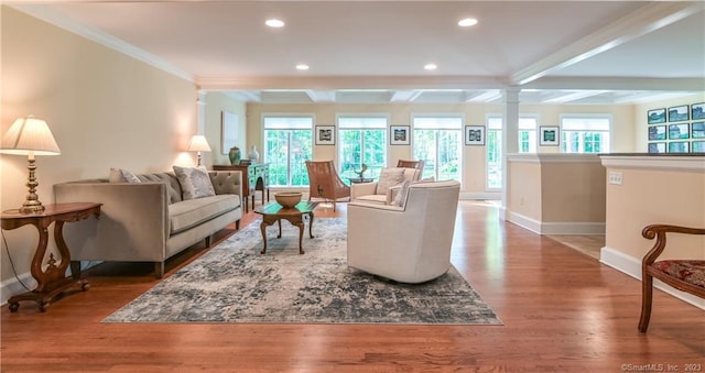12 W Mountain Rd, Sharon, CT 06069 - living room featuring ornate columns, beam ceiling, baseboards, and wood finished floors