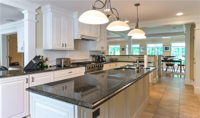 12 W Mountain Rd, Sharon, CT 06069 - kitchen featuring crown molding, plenty of natural light, high end stove, and a sink