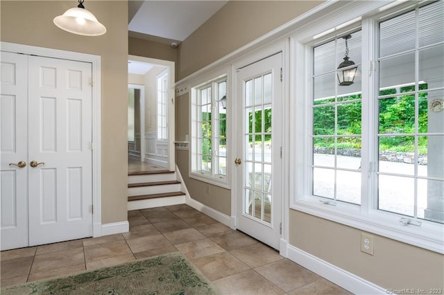12 W Mountain Rd, Sharon, CT 06069 - doorway with baseboards, a wealth of natural light, and tile patterned floors