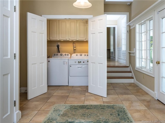 12 W Mountain Rd, Sharon, CT 06069 - laundry room featuring baseboards, cabinet space, washing machine and clothes dryer, and light tile patterned floors