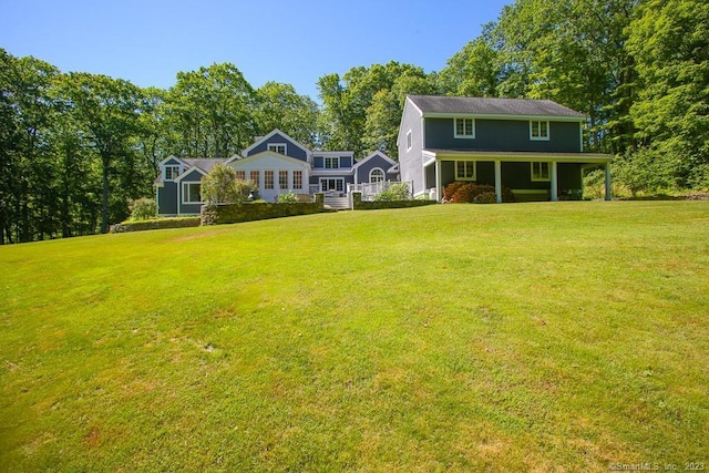 12 W Mountain Rd, Sharon, CT 06069 - rear view of property featuring a yard