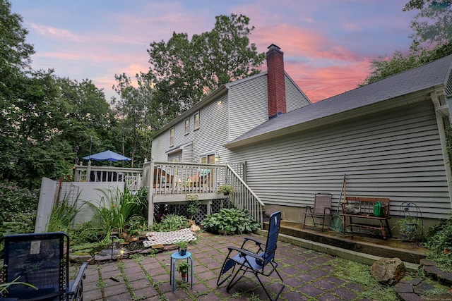 patio terrace at dusk with a deck