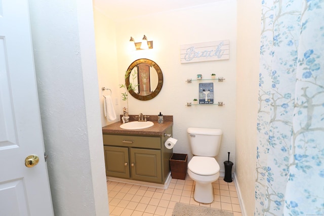 full bath with toilet, tile patterned flooring, baseboards, and vanity