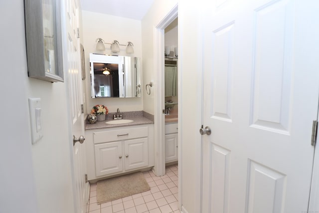 bathroom featuring tile patterned flooring and vanity