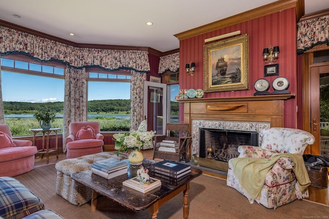 living room featuring a healthy amount of sunlight and crown molding