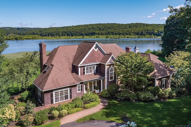 323 River Rd, Deep River, CT 06417 - view of front of property with a water view, a view of trees, a chimney, and a front yard