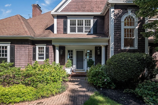 323 River Rd, Deep River, CT 06417 - view of front facade with a porch, roof with shingles, and a chimney
