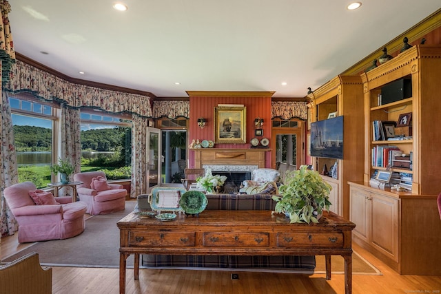 323 River Rd, Deep River, CT 06417 - living area with crown molding, recessed lighting, a fireplace, and light wood-type flooring