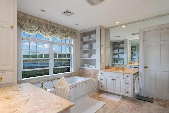 323 River Rd, Deep River, CT 06417 - full bathroom with vanity, a water view, a bath, and visible vents