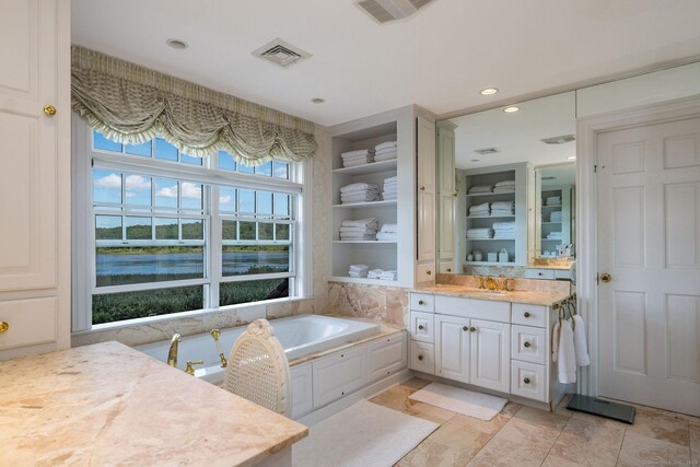 323 River Rd, Deep River, CT 06417 - full bath featuring vanity, a bath, a water view, and recessed lighting