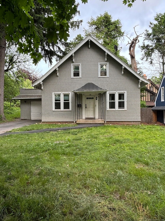 view of front facade with a garage and a front yard