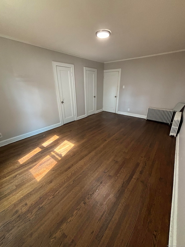 unfurnished room featuring dark wood-type flooring