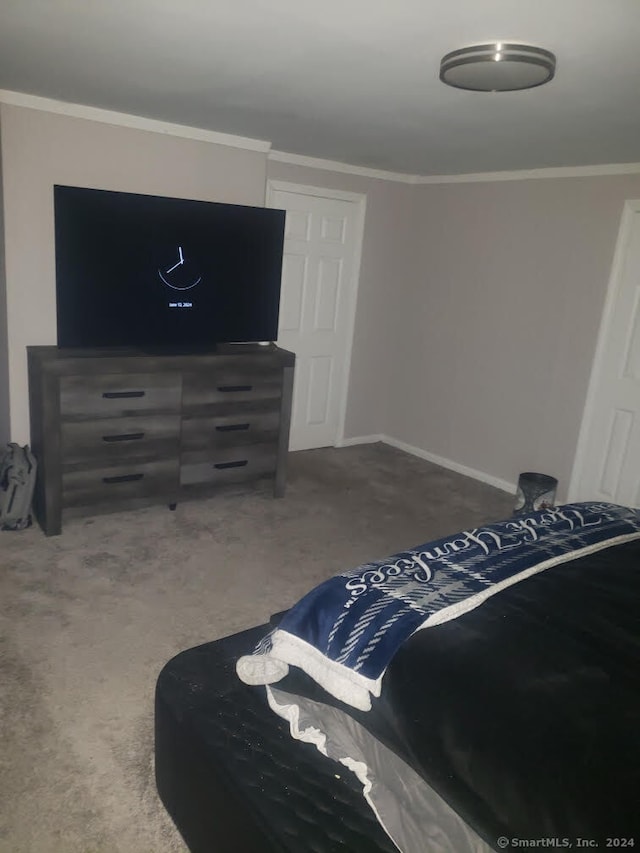 bedroom with carpet flooring and ornamental molding