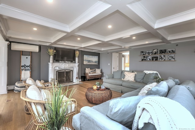 living room featuring a high end fireplace, coffered ceiling, light hardwood / wood-style flooring, and an AC wall unit