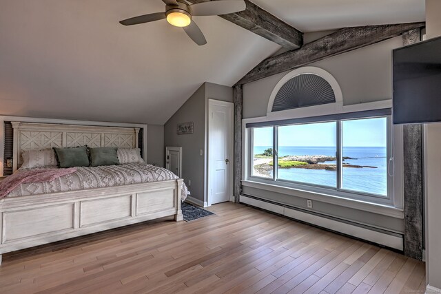 bedroom with baseboard heating, ceiling fan, vaulted ceiling with beams, and light hardwood / wood-style floors