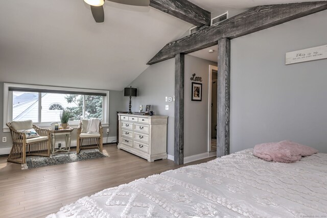 bedroom with ceiling fan, lofted ceiling with beams, and wood-type flooring