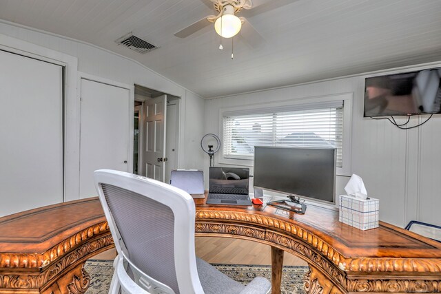 office space featuring hardwood / wood-style floors, vaulted ceiling, and ceiling fan