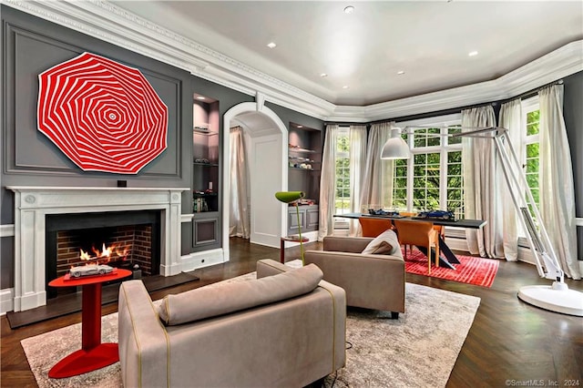 living room featuring crown molding, dark parquet floors, baseboard heating, and plenty of natural light