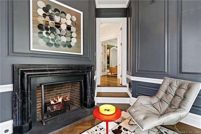 sitting room featuring ornamental molding