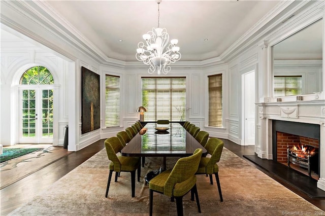 sunroom featuring a notable chandelier and plenty of natural light