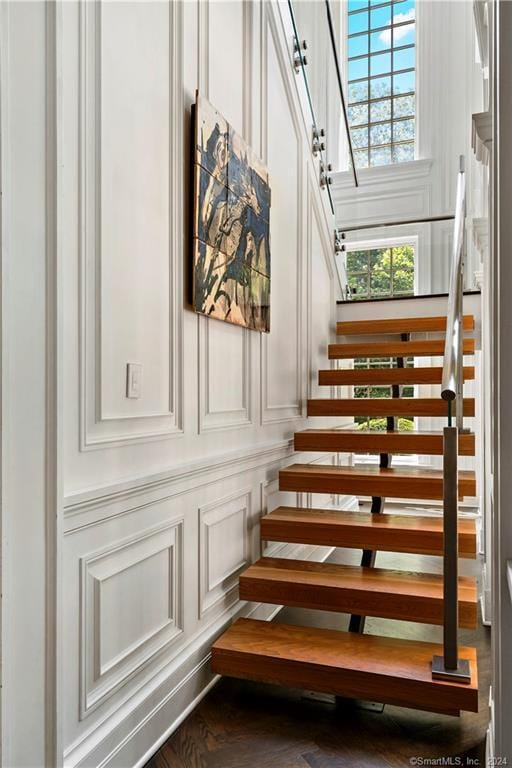 stairway with hardwood / wood-style floors