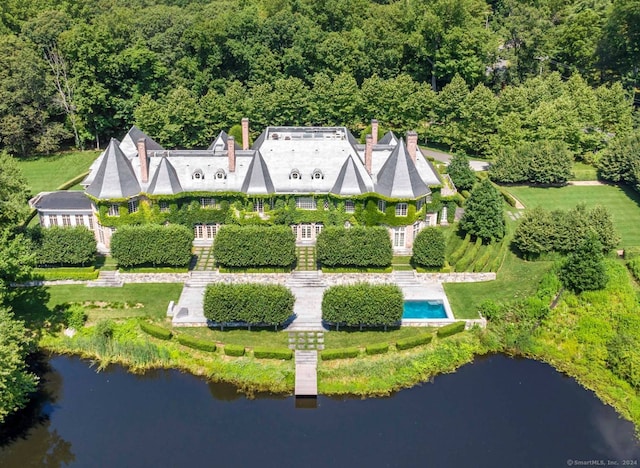 birds eye view of property with a water view