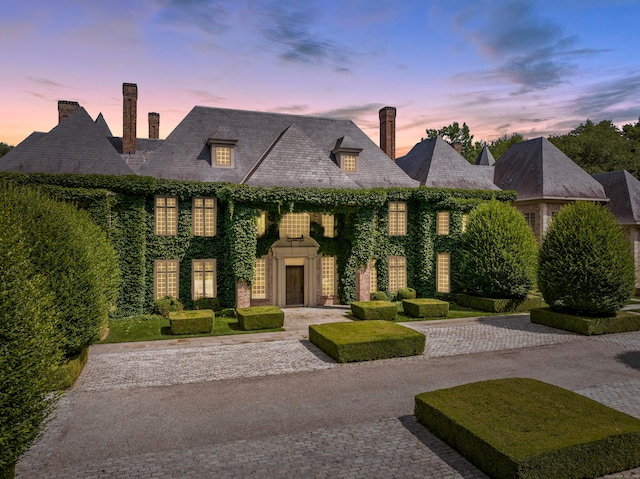 266 Michigan Rd, New Canaan, CT 06840 - french provincial home featuring a chimney and curved driveway