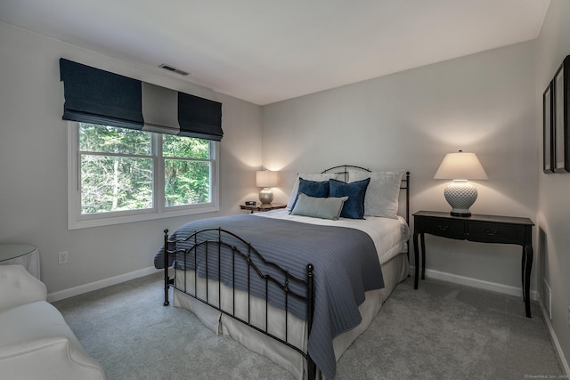 bedroom featuring carpet, visible vents, and baseboards