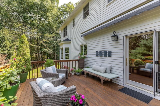 wooden deck featuring outdoor lounge area