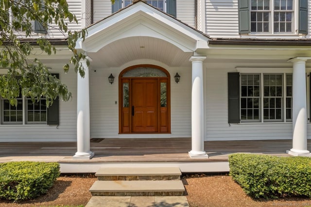 doorway to property featuring a porch