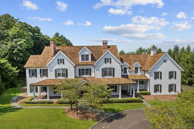 view of front of home with a front lawn and a porch