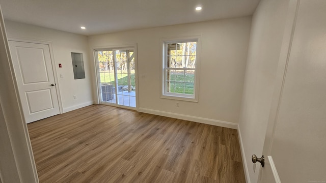 18 Summer Brook Way, Seymour, CT 06483 - empty room featuring electric panel, baseboards, light wood-type flooring, and recessed lighting