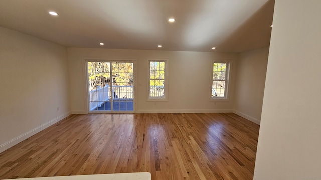 unfurnished room with light hardwood / wood-style flooring