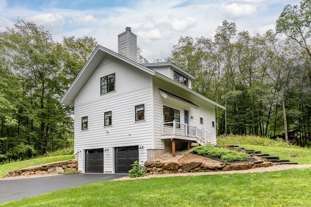 view of side of property with a garage