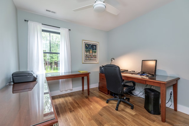 office space featuring wood-type flooring and ceiling fan