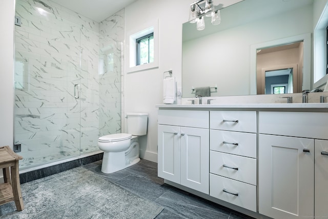 bathroom with vanity, toilet, and an enclosed shower