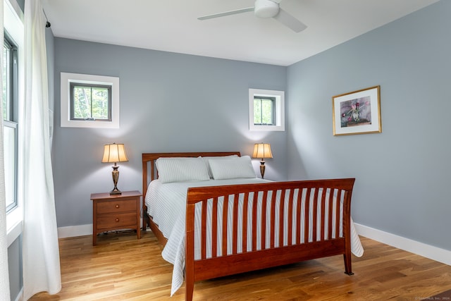 bedroom with wood-type flooring and ceiling fan