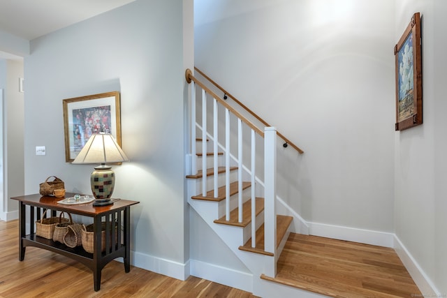 stairway featuring hardwood / wood-style floors