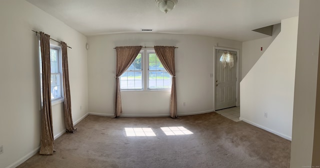 empty room with light colored carpet