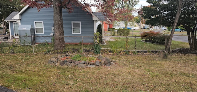 view of side of property with a lawn