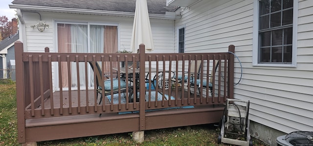 wooden terrace featuring central AC unit