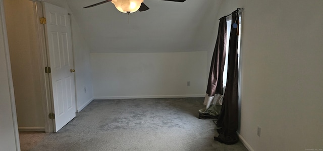 additional living space featuring lofted ceiling, light colored carpet, and ceiling fan